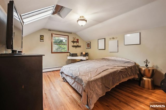 11 Beech Ct, Ringwood, NJ 07456 - bedroom featuring a baseboard heating unit, vaulted ceiling, and light wood finished floors