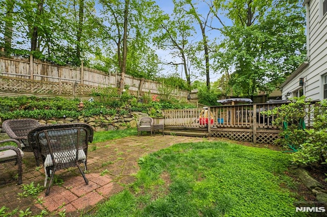 11 Beech Ct, Ringwood, NJ 07456 - fenced backyard featuring a deck and a patio