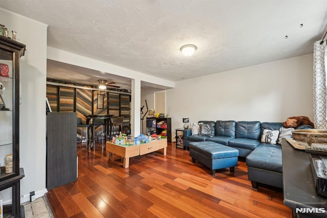 11 Beech Ct, Ringwood, NJ 07456 - living room with a ceiling fan, a textured ceiling, and wood finished floors