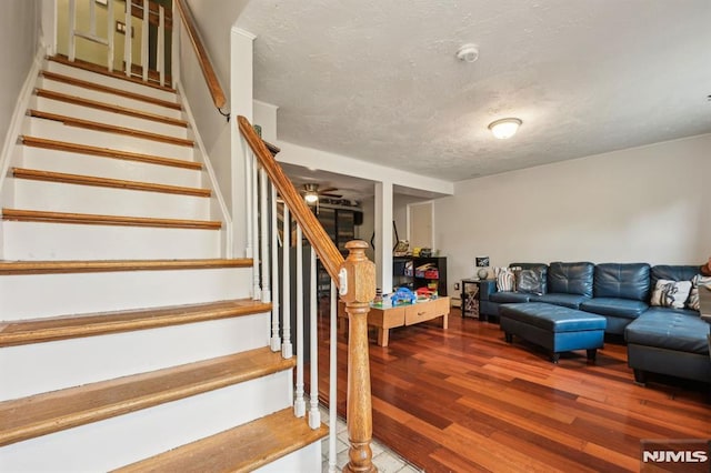 11 Beech Ct, Ringwood, NJ 07456 - staircase featuring wood finished floors, a textured ceiling, and ceiling fan