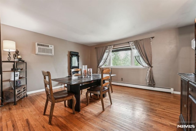 11 Beech Ct, Ringwood, NJ 07456 - dining room featuring a baseboard heating unit, a wall mounted AC, light wood-style flooring, and baseboards