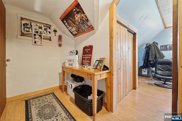 136 Shippen St, Weehawken, NJ 07086 - hallway featuring lofted ceiling, wood finished floors, and baseboards