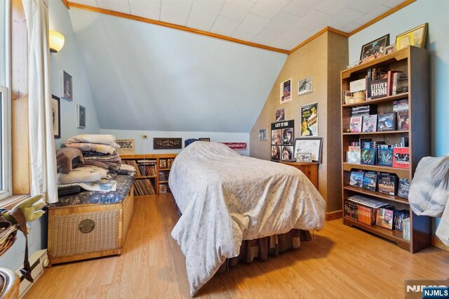 136 Shippen St, Weehawken, NJ 07086 - bedroom with lofted ceiling, wood finished floors, and ornamental molding