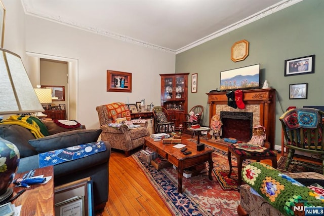 136 Shippen St, Weehawken, NJ 07086 - living area with hardwood / wood-style floors, crown molding, and a fireplace with raised hearth