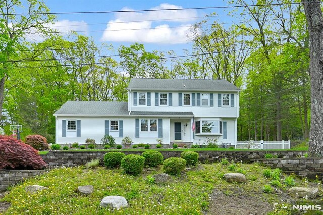 colonial house with fence