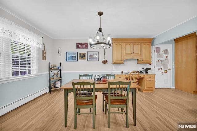 dining room featuring a baseboard heating unit, a chandelier, light wood-type flooring, and ornamental molding