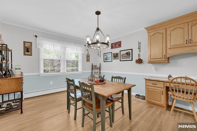 dining area featuring a baseboard heating unit, a chandelier, light wood-style floors, ornamental molding, and a desk