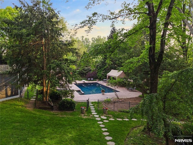 2 Canterbury Ct, Alpine, NJ 07620 - pool at dusk featuring a patio area