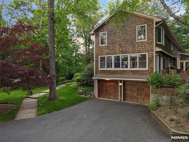 2 Canterbury Ct, Alpine, NJ 07620 - view of property exterior with an attached garage and asphalt driveway
