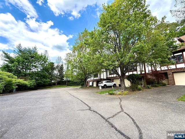 view of front of house with asphalt driveway