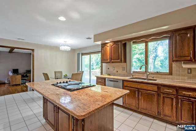 2 Morgan Ct, Montvale, NJ 07645 - kitchen with a sink, black electric cooktop, a center island, and tasteful backsplash
