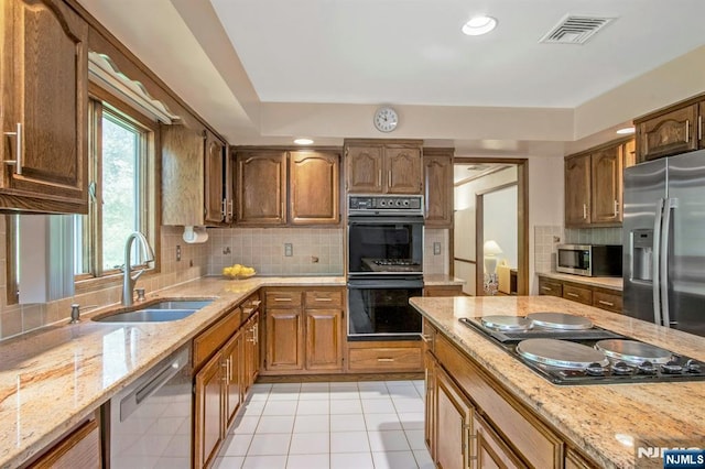 2 Morgan Ct, Montvale, NJ 07645 - kitchen with black appliances, a sink, backsplash, light stone countertops, and light tile patterned flooring