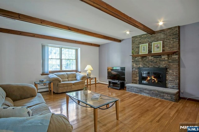2 Morgan Ct, Montvale, NJ 07645 - living area with a baseboard heating unit, wood finished floors, beamed ceiling, a brick fireplace, and baseboards