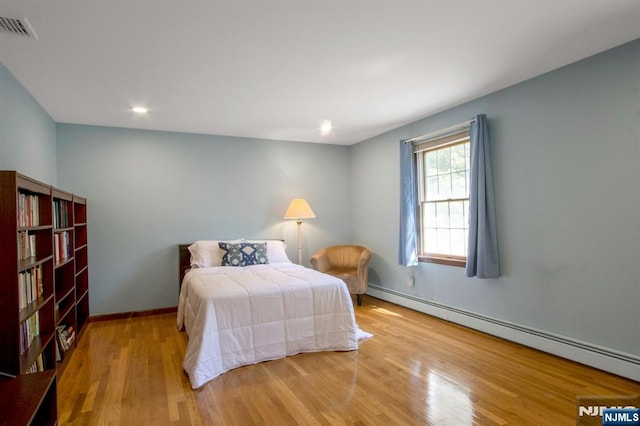 2 Morgan Ct, Montvale, NJ 07645 - bedroom featuring a baseboard radiator, wood finished floors, baseboards, and recessed lighting