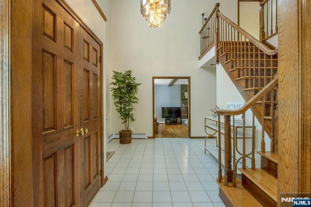 2 Morgan Ct, Montvale, NJ 07645 - entrance foyer featuring a high ceiling, stairway, light tile patterned floors, a chandelier, and baseboards