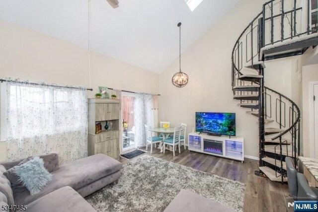 4 Winter Park Dr Unit 4, Vernon, NJ 07462 - living area featuring high vaulted ceiling, wood finished floors, stairway, a chandelier, and baseboards