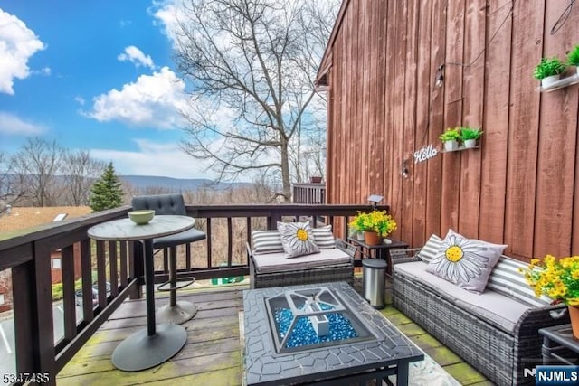 4 Winter Park Dr Unit 4, Vernon, NJ 07462 - view of wooden balcony with a deck and an outdoor living space with a fire pit