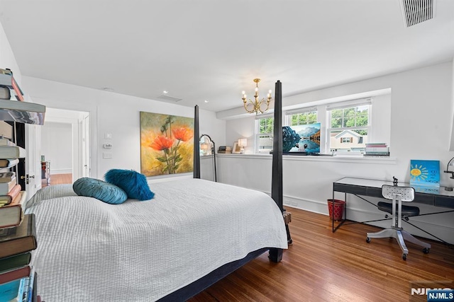 868 Goffle Rd, Hawthorne, NJ 07506 - bedroom featuring wood finished floors and a chandelier