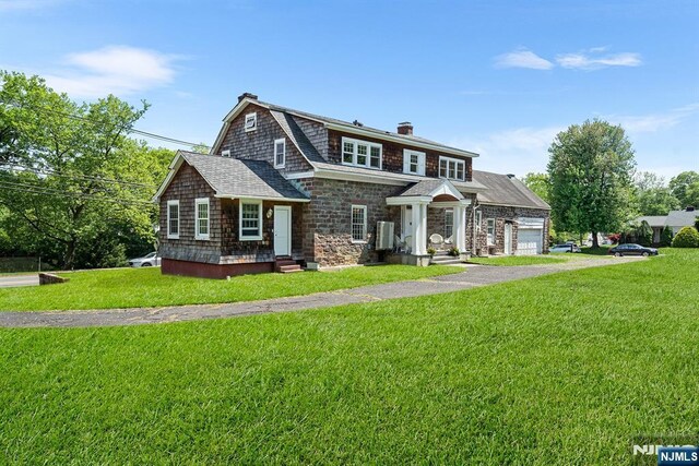868 Goffle Rd, Hawthorne, NJ 07506 - shingle-style home with an attached garage, a chimney, a front yard, and stone siding