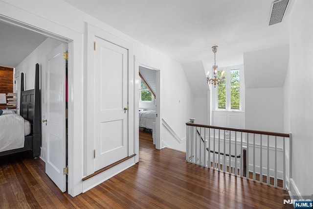 868 Goffle Rd, Hawthorne, NJ 07506 - corridor with an upstairs landing, plenty of natural light, wood finished floors, a chandelier, and vaulted ceiling
