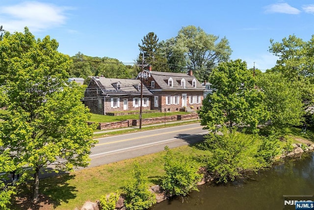 868 Goffle Rd, Hawthorne, NJ 07506 - rear view of house featuring a chimney