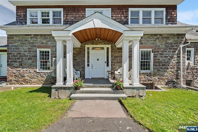 868 Goffle Rd, Hawthorne, NJ 07506 - entrance to property featuring stone siding, a yard, and covered porch
