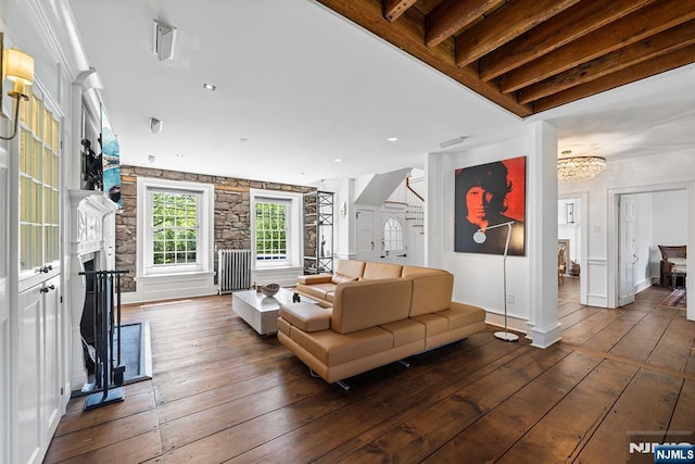 868 Goffle Rd, Hawthorne, NJ 07506 - living room featuring hardwood / wood-style flooring, a fireplace with raised hearth, stairs, baseboards, and a chandelier