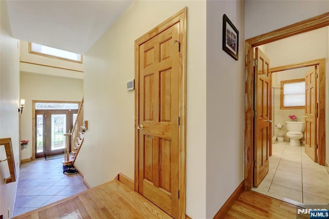 543 Page Ave, Lyndhurst, NJ 07071 - entrance foyer with light tile patterned flooring, stairway, and baseboards