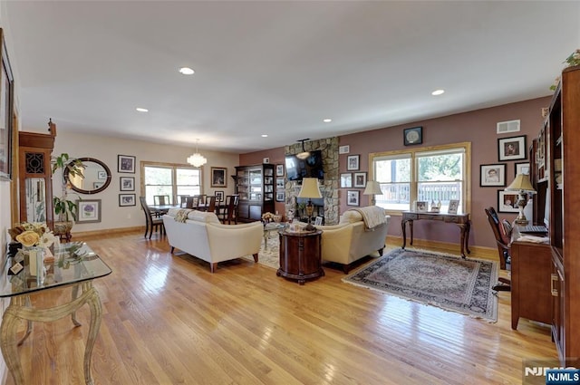 543 Page Ave, Lyndhurst, NJ 07071 - living room with a chandelier, light wood-type flooring, baseboards, and recessed lighting