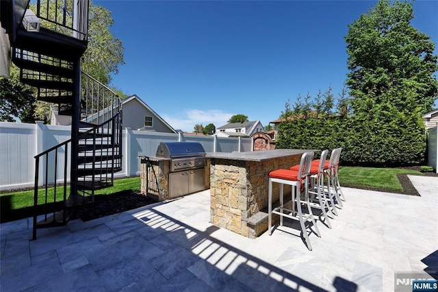543 Page Ave, Lyndhurst, NJ 07071 - fenced backyard featuring stairway and a patio