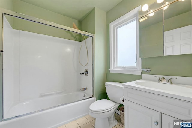 full bathroom featuring tile patterned floors, toilet, shower / washtub combination, and vanity