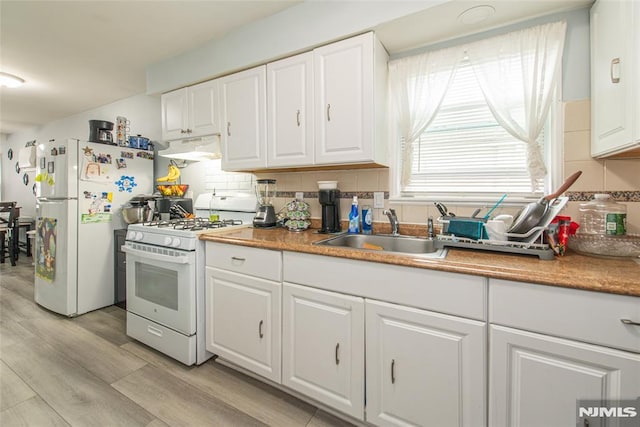 20 Park Dr, Oakland, NJ 07436 - kitchen with white appliances, a sink, range hood, white cabinetry, and tasteful backsplash
