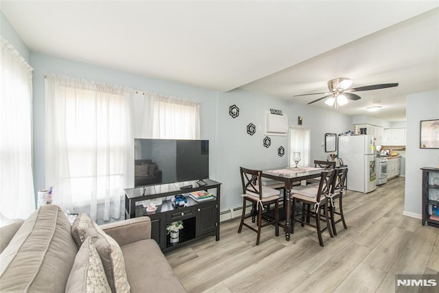 20 Park Dr, Oakland, NJ 07436 - dining area featuring baseboard heating, light wood-style floors, and a ceiling fan