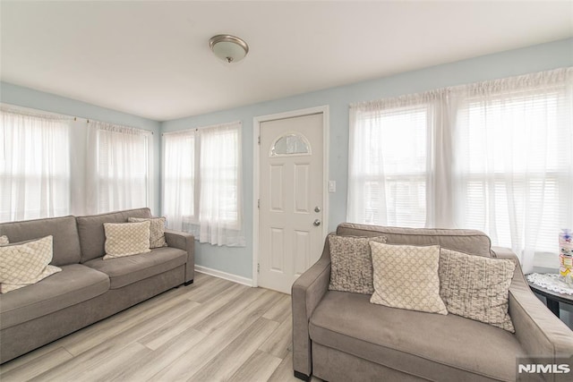 20 Park Dr, Oakland, NJ 07436 - living area featuring light wood-style flooring, plenty of natural light, and baseboards