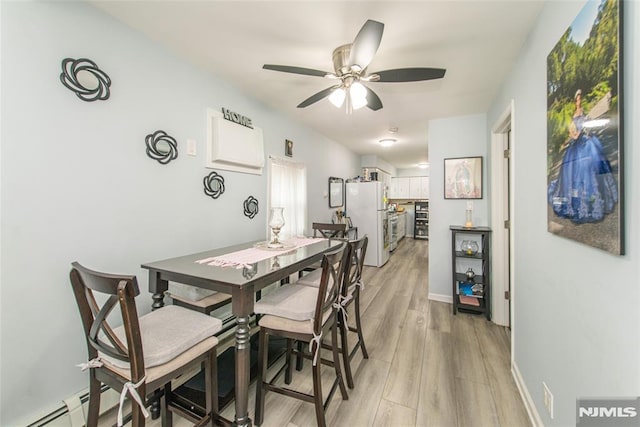 20 Park Dr, Oakland, NJ 07436 - dining area with light wood-style flooring, a ceiling fan, and baseboards