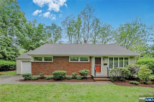 38 Pitcairn Ave, Ho-Ho-Kus, NJ 07423 - view of front of house featuring a front yard, a chimney, driveway, and a garage