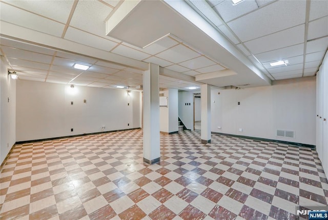 38 Pitcairn Ave, Ho-Ho-Kus, NJ 07423 - finished below grade area with a paneled ceiling, baseboards, tile patterned floors, and stairway