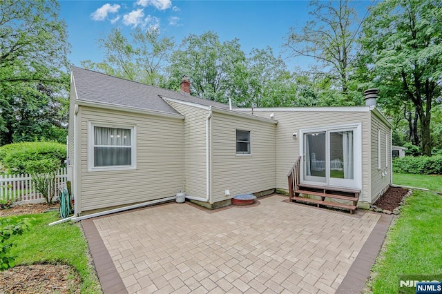 38 Pitcairn Ave, Ho-Ho-Kus, NJ 07423 - rear view of property with a chimney, a patio area, and entry steps