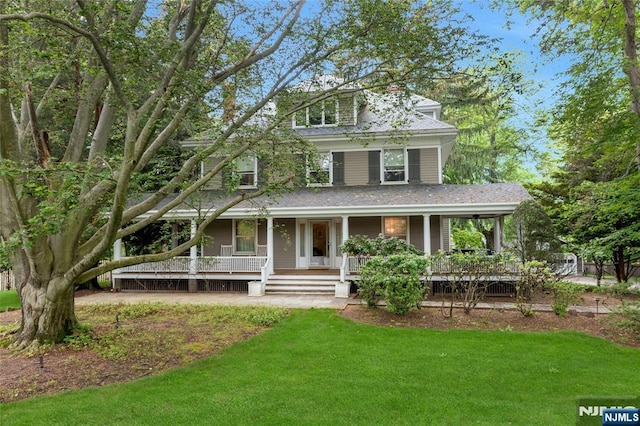 view of front facade with a porch and a front yard
