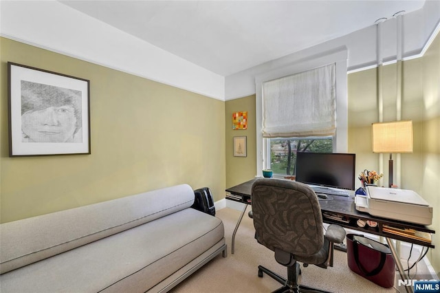carpeted office space with baseboards