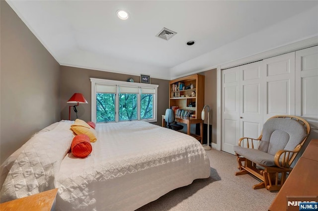 bedroom with light carpet, a closet, and recessed lighting