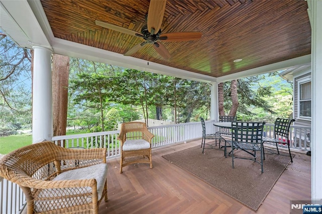 deck with ceiling fan and outdoor dining area