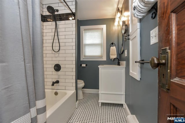 38 Arlington Ave, Hawthorne, NJ 07506 - full bathroom featuring toilet, a sink, shower / bath combination with curtain, baseboards, and tile patterned floors