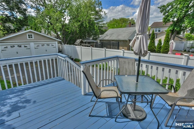 38 Arlington Ave, Hawthorne, NJ 07506 - deck with a garage, a fenced backyard, and an outbuilding