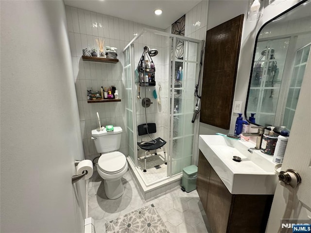 717 1st St, Lyndhurst, NJ 07071 - bathroom featuring toilet, a stall shower, vanity, tile patterned flooring, and recessed lighting