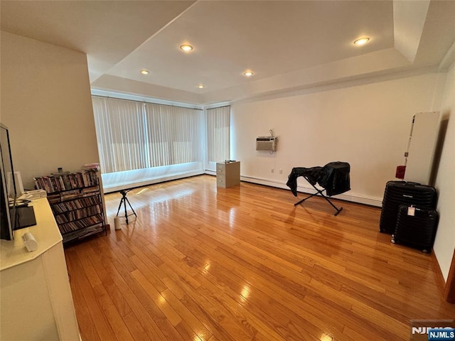 717 1st St, Lyndhurst, NJ 07071 - living area with hardwood / wood-style flooring, a tray ceiling, recessed lighting, and a wall unit AC