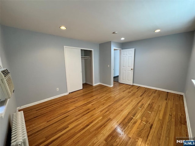 717 1st St, Lyndhurst, NJ 07071 - unfurnished bedroom featuring radiator, light wood finished floors, baseboards, and recessed lighting