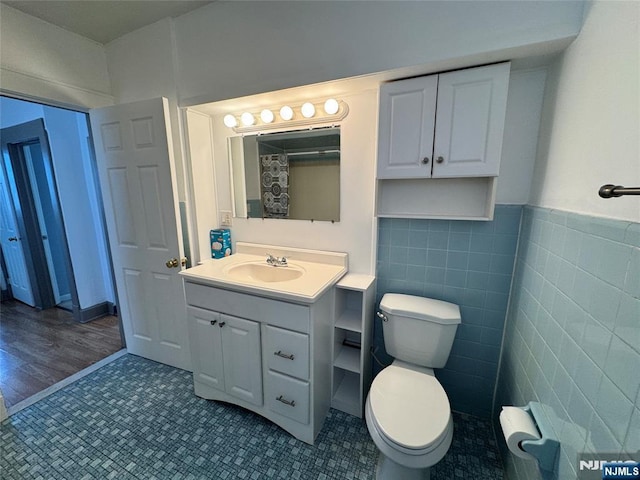 717 1st St, Lyndhurst, NJ 07071 - full bathroom featuring radiator heating unit, toilet, vanity, tile walls, and tile patterned floors
