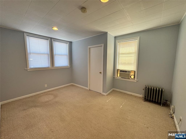 717 1st St, Lyndhurst, NJ 07071 - unfurnished bedroom with radiator heating unit, carpet, baseboards, and cooling unit
