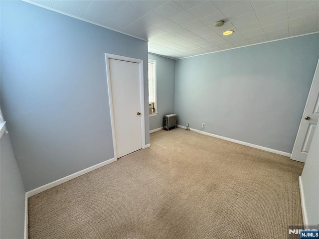 717 1st St, Lyndhurst, NJ 07071 - carpeted spare room featuring radiator, baseboards, and a smoke detector
